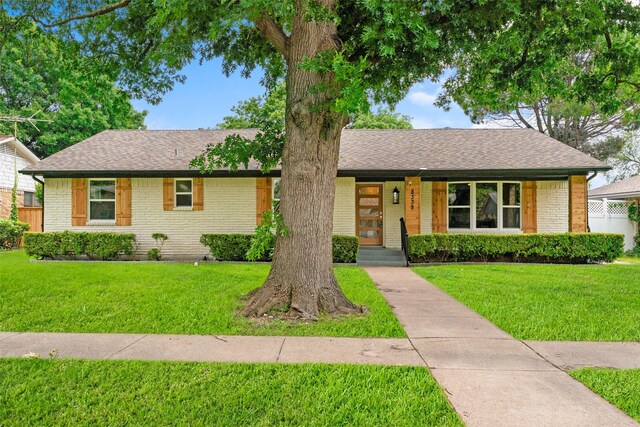 8338 Bocowood Dr, Dallas, TX 75228 - single story home featuring brick siding, a front yard, a shingled roof, and a porch