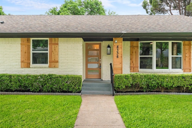 8338 Bocowood Dr, Dallas, TX 75228 - view of front facade with a shingled roof and brick siding
