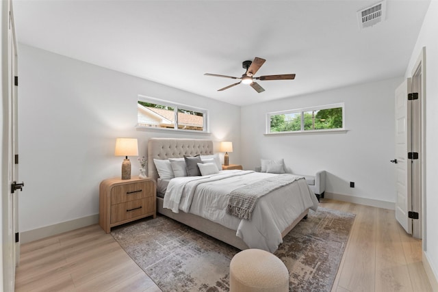 8338 Bocowood Dr, Dallas, TX 75228 - bedroom featuring light wood-style flooring, baseboards, and ceiling fan