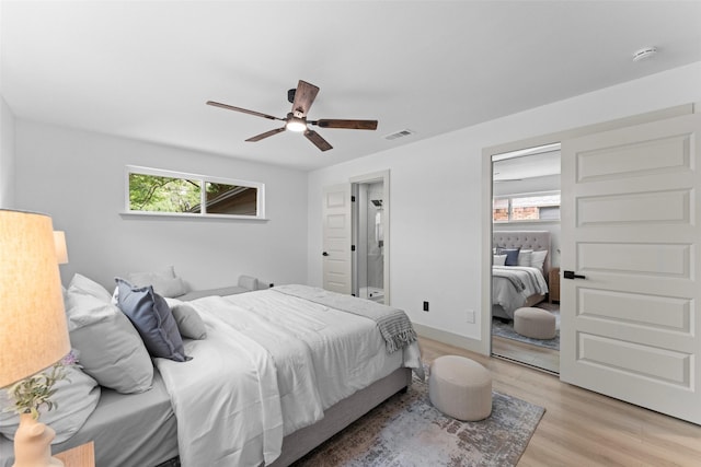 8338 Bocowood Dr, Dallas, TX 75228 - bedroom featuring multiple windows, light wood-type flooring, and ceiling fan