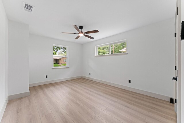 8338 Bocowood Dr, Dallas, TX 75228 - spare room with ceiling fan, light wood-type flooring, and baseboards