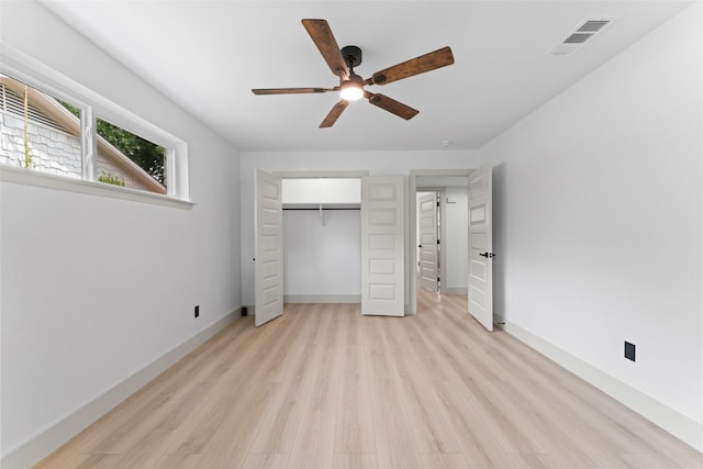 8338 Bocowood Dr, Dallas, TX 75228 - unfurnished bedroom featuring light wood-type flooring, baseboards, a closet, and ceiling fan