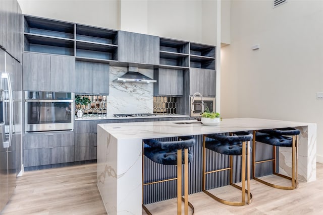 13554 Pyramid Dr, Farmers Branch, TX 75234 - kitchen featuring open shelves, appliances with stainless steel finishes, a sink, wall chimney range hood, and modern cabinets