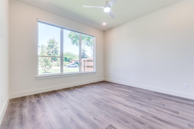 13554 Pyramid Dr, Farmers Branch, TX 75234 - spare room with baseboards, wood finished floors, a ceiling fan, and recessed lighting
