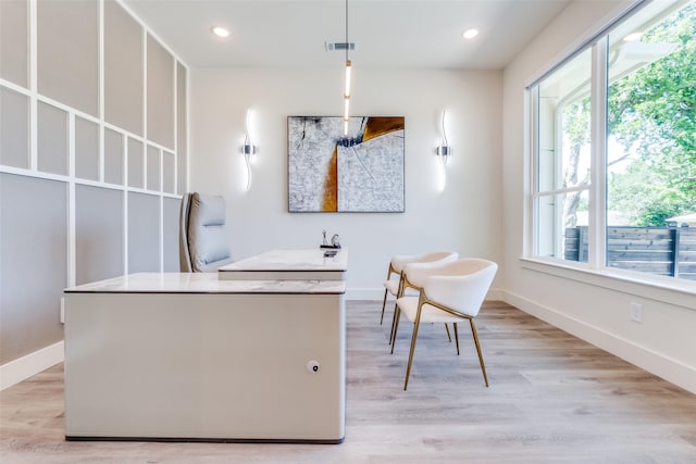 13554 Pyramid Dr, Farmers Branch, TX 75234 - kitchen featuring plenty of natural light, light wood-style floors, baseboards, recessed lighting, and hanging light fixtures
