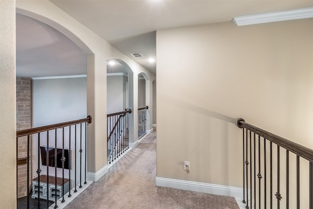 208 Johnson St, Granbury, TX 76048 - hallway featuring carpet, baseboards, ornamental molding, and an upstairs landing
