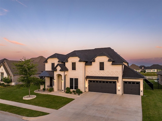 208 Johnson St, Granbury, TX 76048 - french country style house featuring driveway, a standing seam roof, a garage, and stucco siding