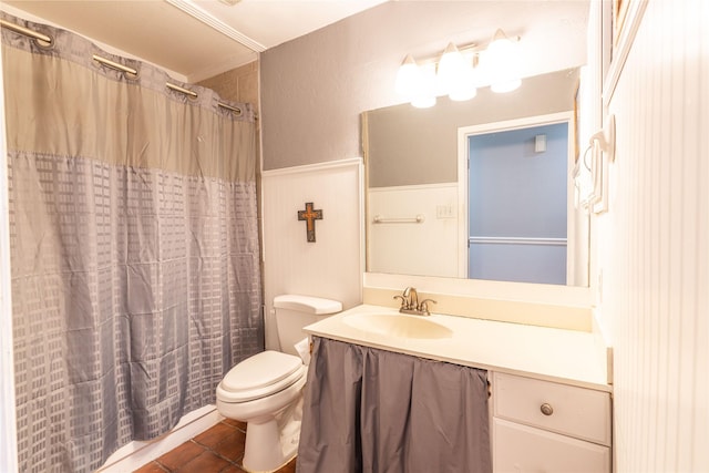 full bath with toilet, tile patterned floors, a wainscoted wall, vanity, and a shower with shower curtain