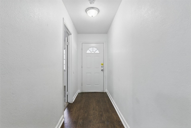 6716 Alma St, Forest Hill, TX 76140 - doorway with dark wood-style flooring and baseboards