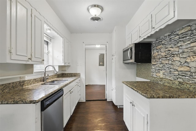 6716 Alma St, Forest Hill, TX 76140 - kitchen with appliances with stainless steel finishes, a sink, dark wood-type flooring, white cabinets, and electric panel