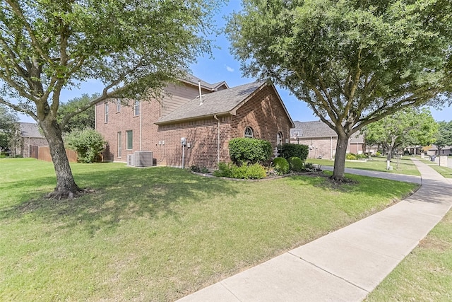8306 Pecan Creek Dr, Arlington, TX 76001 - view of side of property featuring brick siding, a lawn, cooling unit, and roof with shingles