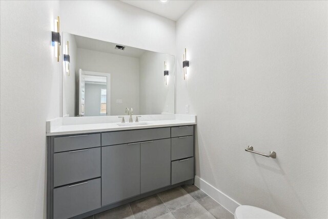 1903 Varsity Dr, Grand Prairie, TX 75051 - bathroom featuring baseboards, vanity, and tile patterned floors