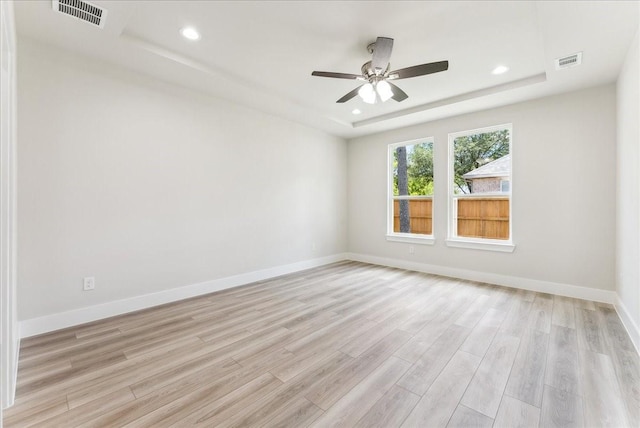 1903 Varsity Dr, Grand Prairie, TX 75051 - unfurnished room with a raised ceiling, light wood finished floors, a ceiling fan, recessed lighting, and baseboards