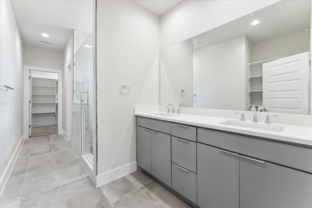 1903 Varsity Dr, Grand Prairie, TX 75051 - full bath featuring baseboards, a stall shower, a spacious closet, double vanity, and recessed lighting