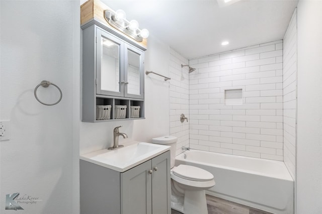 2942 Russell Ave, Abilene, TX 79605 - full bath with wood finished floors, washtub / shower combination, toilet, and vanity