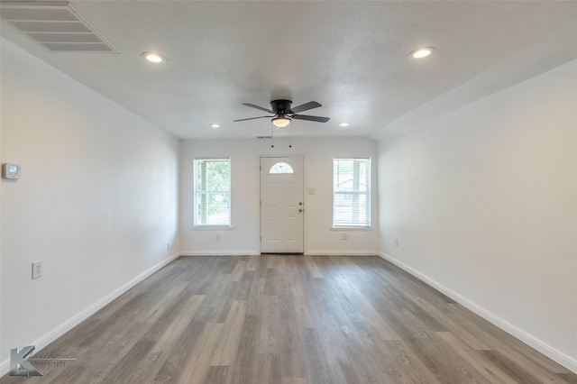 2942 Russell Ave, Abilene, TX 79605 - foyer with healthy amount of natural light, wood finished floors, a ceiling fan, baseboards, and recessed lighting