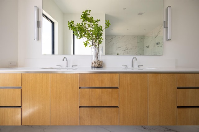 610 N Oak Cliff Blvd Unit 301, Dallas, TX 75208 - bathroom with double vanity and a marble finish shower