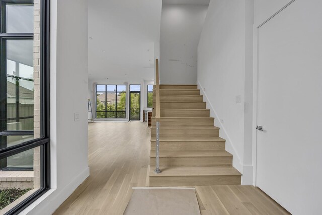 610 N Oak Cliff Blvd Unit 301, Dallas, TX 75208 - staircase with wood finished floors