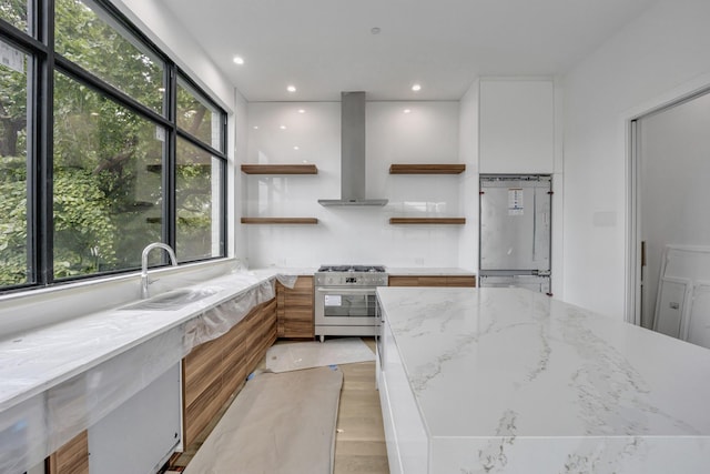 610 N Oak Cliff Blvd Unit 301, Dallas, TX 75208 - kitchen featuring stainless steel range, open shelves, extractor fan, modern cabinets, and white cabinets