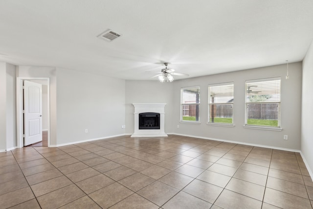 4006 Autumnwood Ln, Heartland, TX 75126 - unfurnished living room featuring ceiling fan, light tile patterned flooring, a fireplace with raised hearth, and baseboards