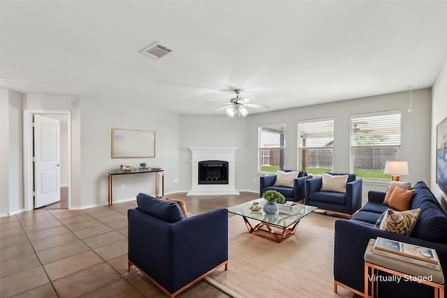 4006 Autumnwood Ln, Heartland, TX 75126 - tiled living room with ceiling fan, a fireplace with raised hearth, and baseboards