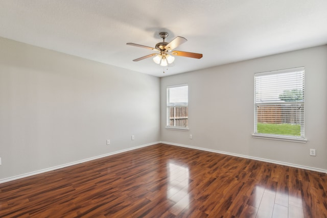 4006 Autumnwood Ln, Heartland, TX 75126 - empty room featuring dark wood-style floors, a ceiling fan, and baseboards