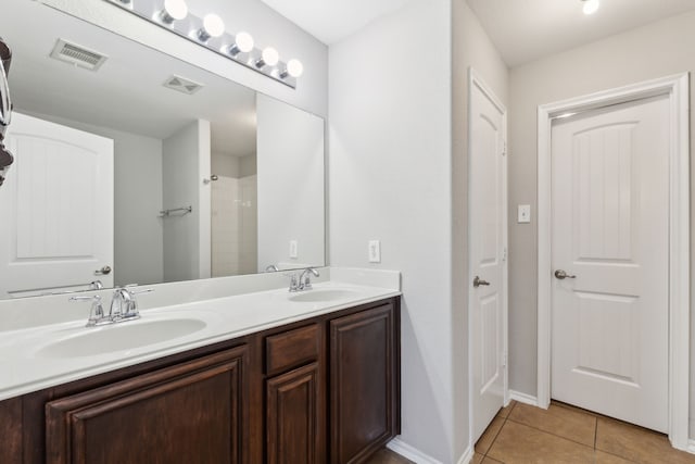 4006 Autumnwood Ln, Heartland, TX 75126 - bathroom with tile patterned flooring, double vanity, and a shower