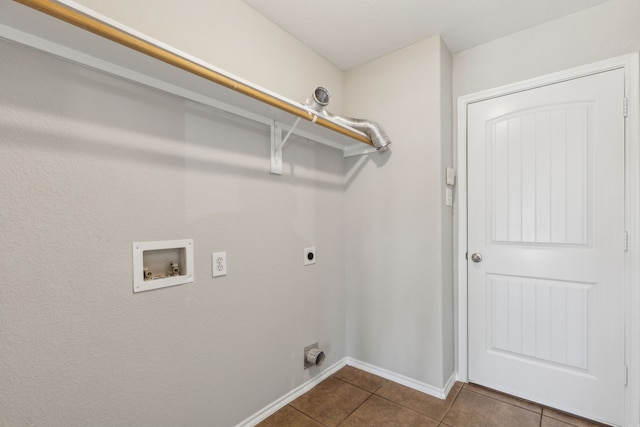 4006 Autumnwood Ln, Heartland, TX 75126 - laundry area featuring electric dryer hookup, washer hookup, dark tile patterned floors, and baseboards