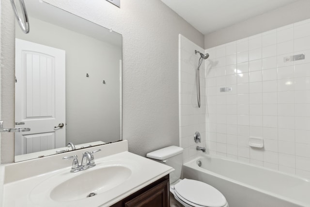 4006 Autumnwood Ln, Heartland, TX 75126 - bathroom with toilet, vanity, tub / shower combination, and a textured wall