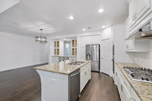 9808 Denali Dr, Little Elm, TX 75068 - kitchen with stainless steel appliances, range hood, tasteful backsplash, dark wood finished floors, and recessed lighting