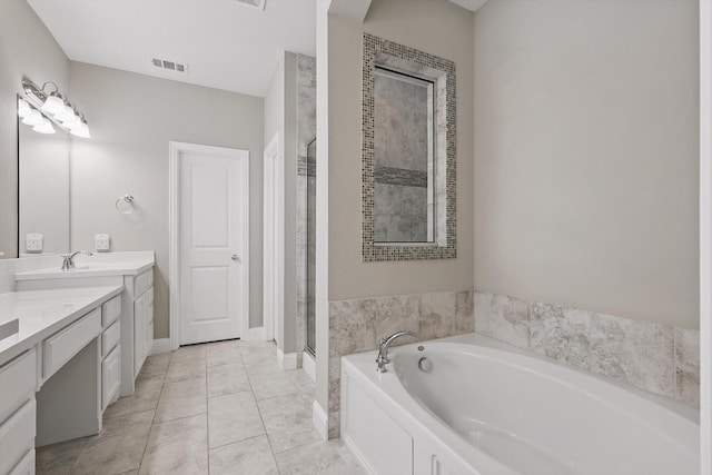 9808 Denali Dr, Little Elm, TX 75068 - full bathroom featuring a bath, a stall shower, vanity, and tile patterned flooring