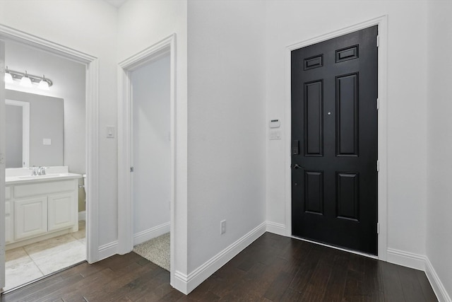 9808 Denali Dr, Little Elm, TX 75068 - foyer featuring dark wood finished floors and baseboards