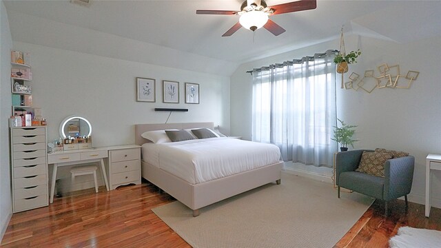 6920 Willow Crest Dr, Mckinney, TX 75070 - bedroom featuring wood finished floors, vaulted ceiling, and a ceiling fan