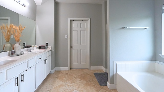 6920 Willow Crest Dr, Mckinney, TX 75070 - bathroom with a bath, double vanity, and tile patterned flooring