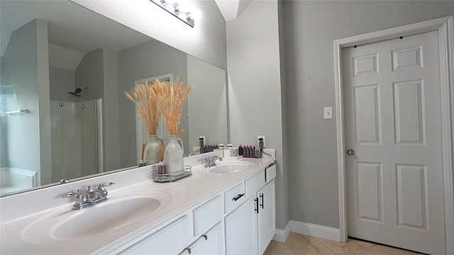 6920 Willow Crest Dr, Mckinney, TX 75070 - bathroom featuring double vanity, baseboards, a shower, and tile patterned flooring