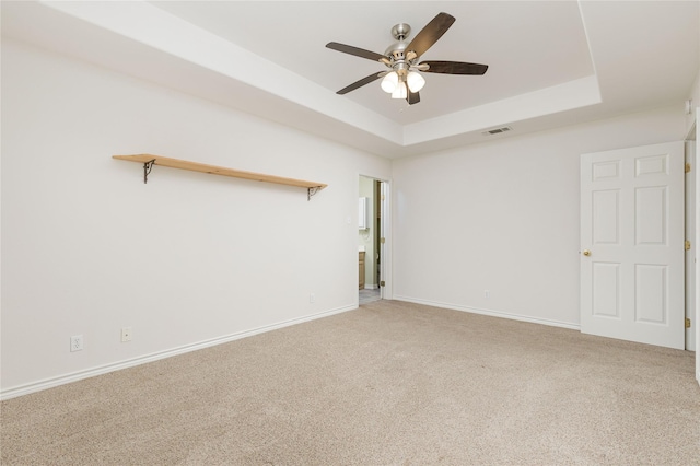709 Billups Cir, Van Alstyne, TX 75495 - carpeted spare room featuring ceiling fan, baseboards, and a tray ceiling