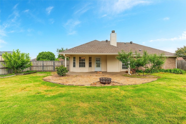 709 Billups Cir, Van Alstyne, TX 75495 - back of property featuring an outdoor fire pit, a patio area, and a chimney