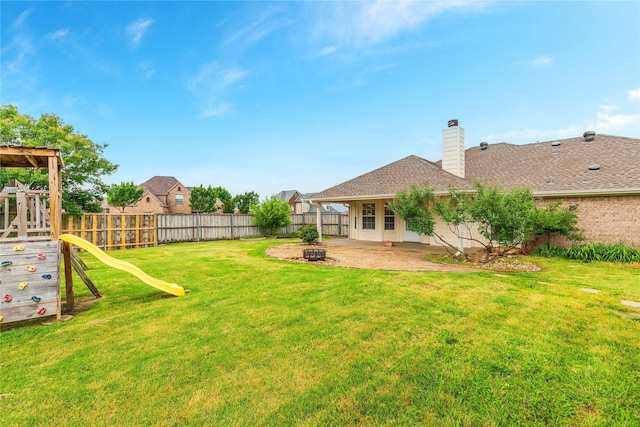 709 Billups Cir, Van Alstyne, TX 75495 - view of yard with a patio area, a playground, and a fire pit