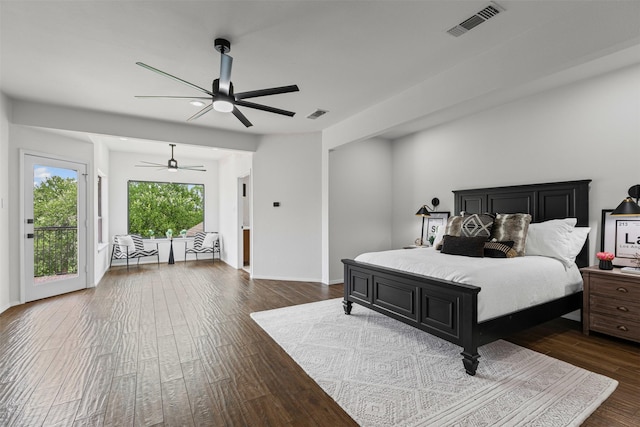 2109 Greta Ln, Fort Worth, TX 76120 - bedroom with dark wood-style flooring, access to exterior, a ceiling fan, and baseboards