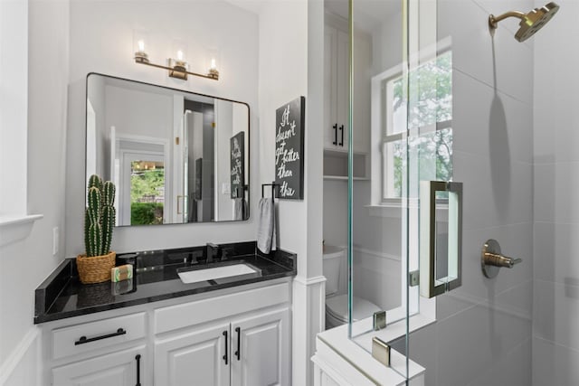 2109 Greta Ln, Fort Worth, TX 76120 - bathroom featuring a shower stall, toilet, and vanity
