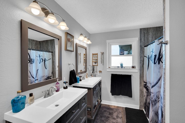 6199 State Highway 22, Hillsboro, TX 76645 - bathroom with a textured ceiling, wood finished floors, two vanities, and curtained shower