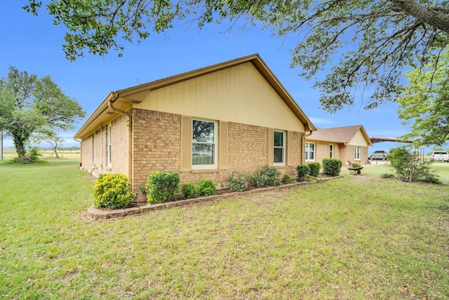 6199 State Highway 22, Hillsboro, TX 76645 - view of home's exterior featuring brick siding and a yard