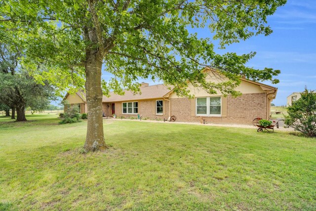 6199 State Highway 22, Hillsboro, TX 76645 - view of front facade with a front lawn and brick siding
