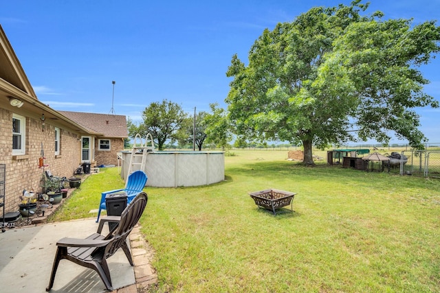 6199 State Highway 22, Hillsboro, TX 76645 - view of yard with a fire pit, an outdoor pool, and a patio area