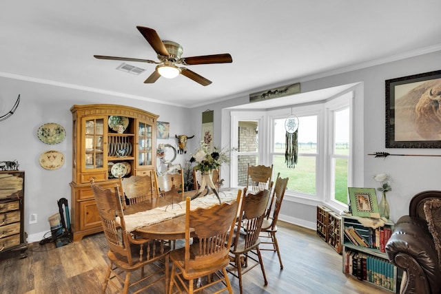 6199 State Highway 22, Hillsboro, TX 76645 - dining area with a ceiling fan, wood finished floors, ornamental molding, and baseboards