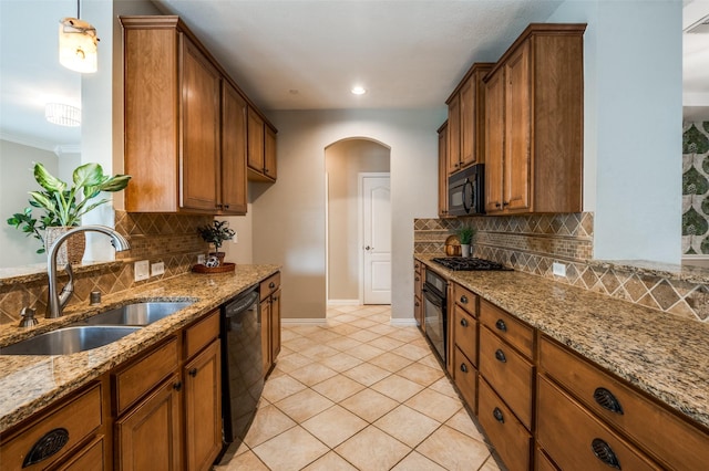 1615 Georgetown Dr, Allen, TX 75013 - kitchen with a sink, black appliances, arched walkways, tasteful backsplash, and crown molding