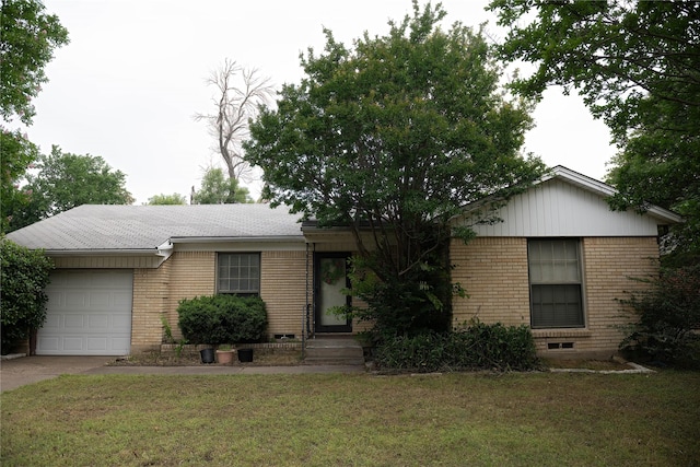 1219 Daisy Ln, Irving, TX 75061 - ranch-style house featuring brick siding, a garage, concrete driveway, and a front lawn