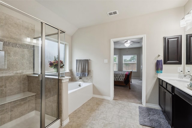 307 Acadia Ln, Forney, TX 75126 - ensuite bathroom featuring a ceiling fan, a shower stall, a garden tub, vanity, and baseboards