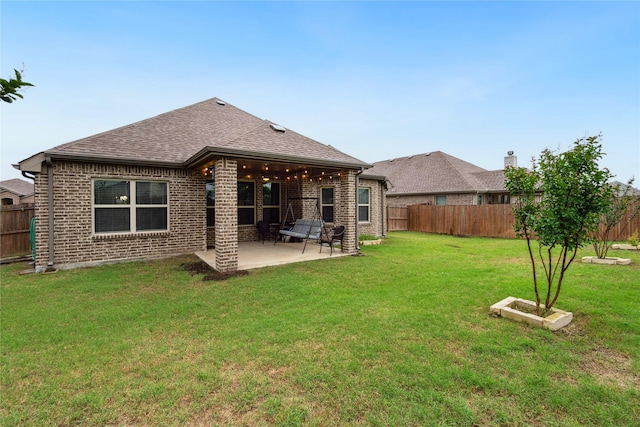 307 Acadia Ln, Forney, TX 75126 - back of house featuring brick siding, a patio area, and a shingled roof