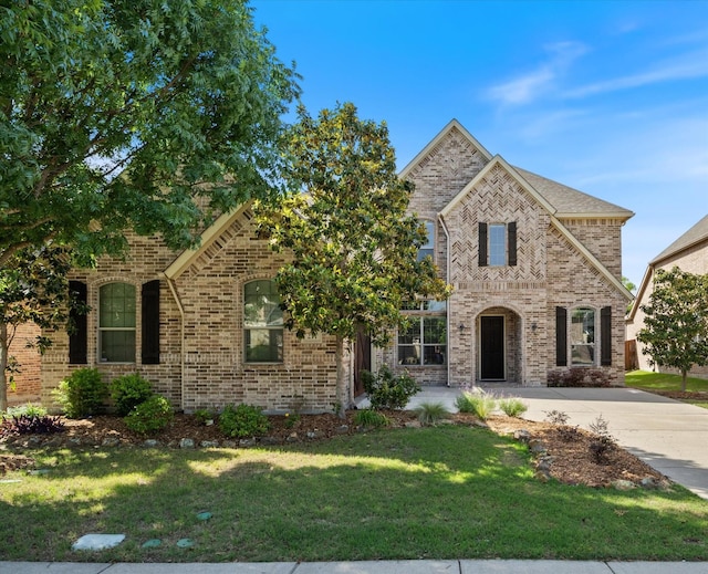 211 Crestbrook Dr, Rockwall, TX 75087 - french provincial home with brick siding and a front lawn